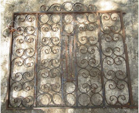 A small iron pedestrian gate with repeating scroll detail, 90 cm in height x 100 cm wide plus hinges 
