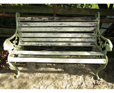 A small iron work bench with timber lathes, together with a further cast iron pub table with female mask mounts (af) 