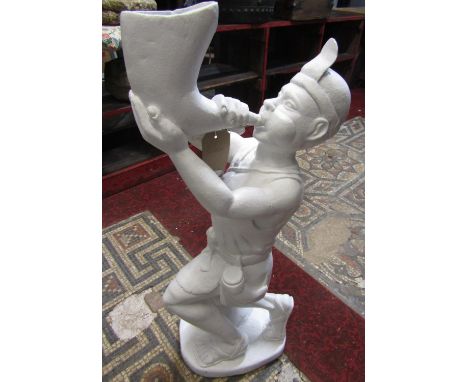 A carved white painted wooden figure of a man in kneeling pose blowing a horn and wearing a simple tunic with tied sash suppo