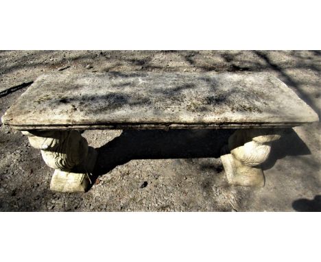 A reclaimed garden bench/low table, the rectangular top supported on two columns in the form of squirrels, 105 cm max 