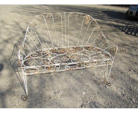 A decorative wirework two seat garden bench