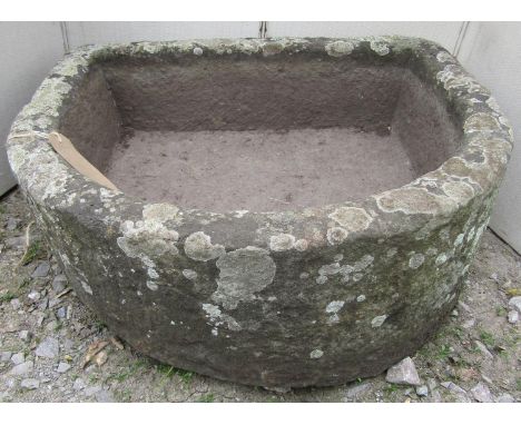 A natural stone D end trough, 55 cm maximum