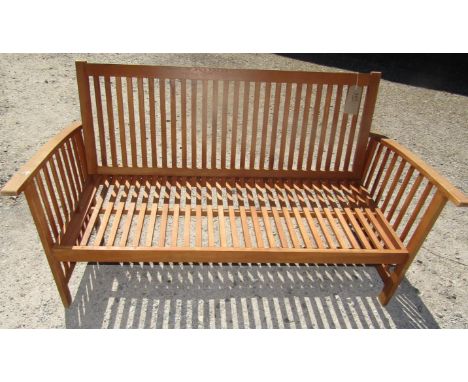 A simple garden bench frame with slatted seat, back and sides 