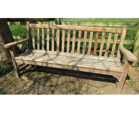 A good teak garden bench with slatted seat and back, 193 cm wide 