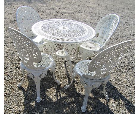 A cast aluminium terrace set, the circular table 80cm diameter with pierced detail raised on a tripod support together with a