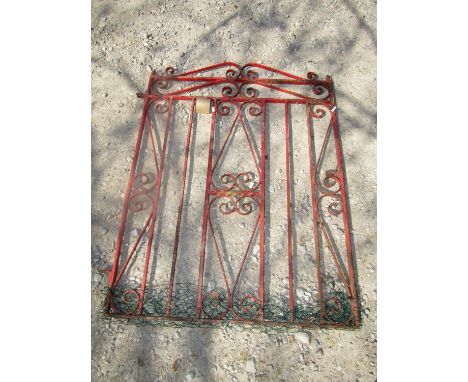 A decorative iron work pedestrian gate with scrolled detail, 85 cm wide excluding hinges, 110 cm in height 