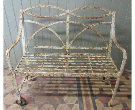 Good Regency strapwork iron bench with decorated back and slatted seat of reeded form, to one side wheels, 104 cm wide 