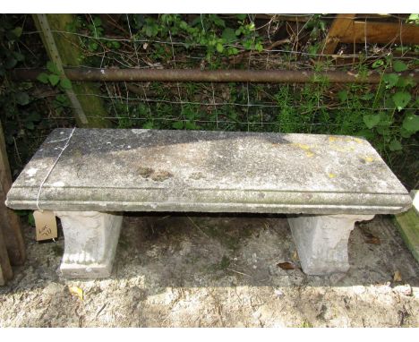 A reclaimed garden bench of rectangular form with moulded outline raised on a pair of supports with acanthus detail,&nbsp;130