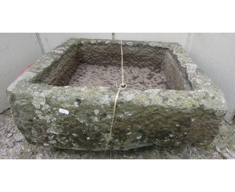 A roughly hewn square cut trough, 55 cm square