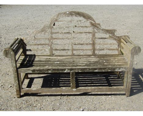 A weathered teakwood garden bench to a Lutyens design, 170 cm wide (the purchaser will be offered the following matching lot 