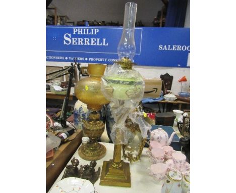 A gilt metal table lamp with glass shade, together with a Duplex oil lamp and a hanging lantern with glass panels