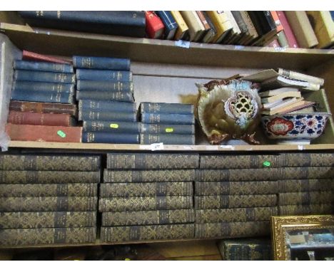 A shelf of encyclopaedias, together with a collection of Dickens, etc.