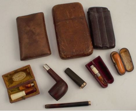 A collection of smoking related items, to include a pipe with hallmarked silver collar, cigar or cigarette holders, on with 9