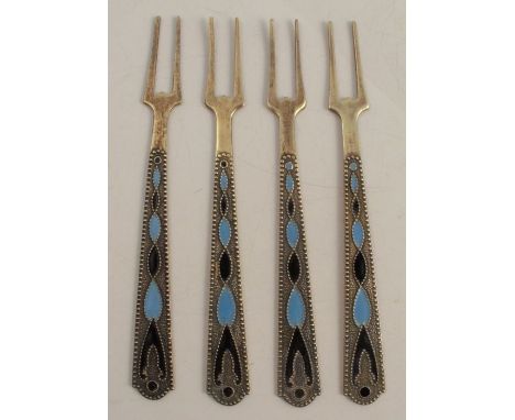 A set of four Russian silver and enamel pickle forks