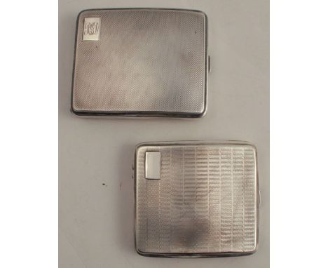 Two hallmarked sivler cigarette cases, both with engine turned decoration, one with initials, total weight 8oz