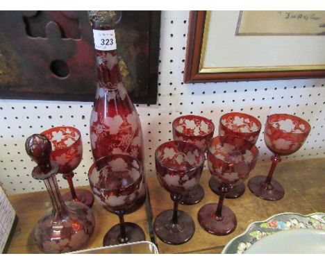 A collection of Victorian ruby glass, to include 7 glasses, a decanter and scent bottle, etched with leaves