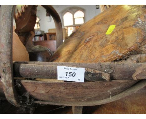 A trug, containing Graham Pigot bust, root carving, etc.