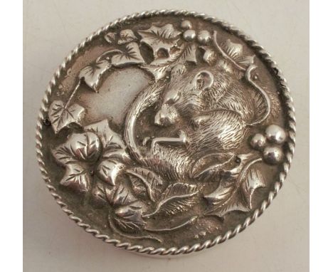 A Birmingham Mint hallmarked silver patch box, of circular form, the cover embossed with a field mouse and leaves, with mirro