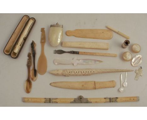 A collection of carved ivory and bone items, to include a folding rule, pickle fork, novelty paper knives, mother of pearl it