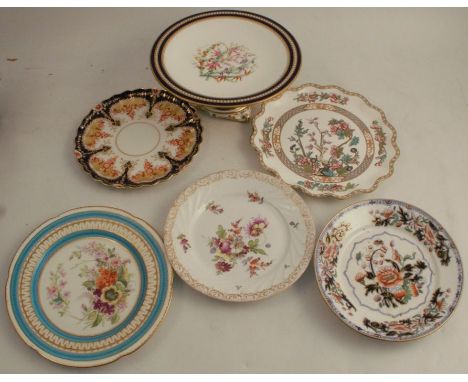 A Victorian porcelain tazza, having a floral hand painted centre, surrounded by a cobalt blue and gilt border with enamelled 