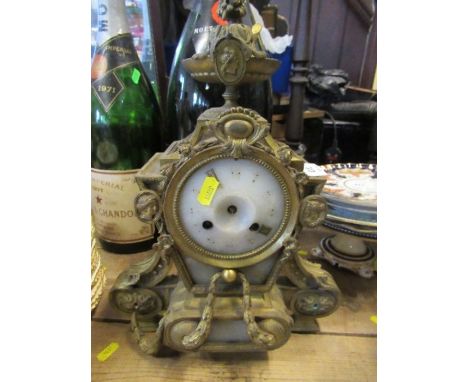 A gilt metal cased mantel clock, inset with marble panels, height 16ins
