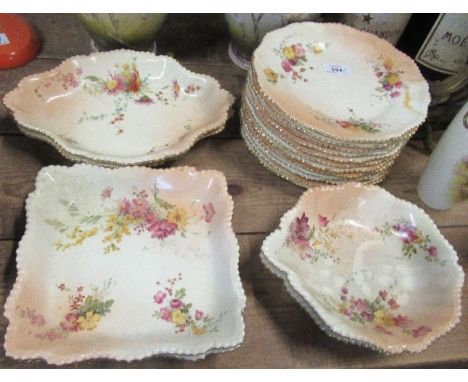 A Royal Worcester blush ivory dessert service, decorated with floral sprays, comprising twelve 9.5ins plates, a pair of shape