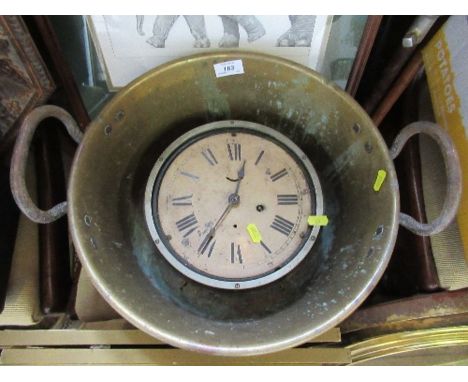 A brass jam pan, together with a clock