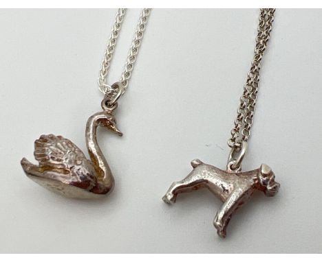2 unmarked white metal animal shaped pendant necklaces, modelled as a bulldog and a swan. Both on 18" silver chains with spri