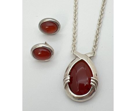 A carnelian set silver pendant on an 18" silver rope chain with spring ring clasp. Together with a pair of costume jewellery 
