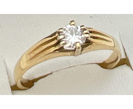 A vintage 22ct gold .25 ct diamond solitaire ring with claw setting and channelled design to shoulders. Fully hallmarked insi