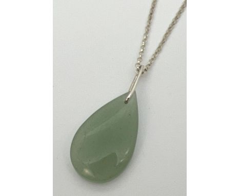 A teardrop shaped jade pendant on a 16" silver belcher chain with spring ring clasp. Stamped 925 to clasp and joining link. P