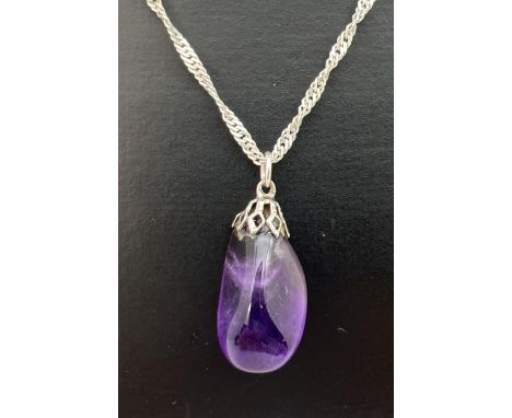 A polished amethyst stone pendant on an 18" silver singapore chain. Chain stamped 925 to spring ring clasp and 925 Italy to h