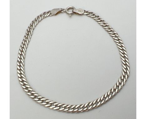 A 7" 925 silver double curb chain bracelet with spring ring clasp. Stamped 925 and Italy to hook end links and stamped 925 to