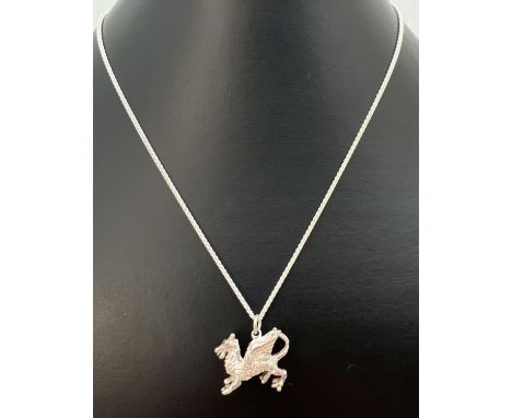 A white metal pendant modelled as a dragon, on an 18" silver rope chain with spring ring clasp. Stamped 925 to both hook end 
