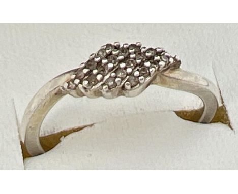 A 925 silver and diamond cluster ring with a diamond shaped mount. Stamped 925 inside band, ring size NÂ½. 