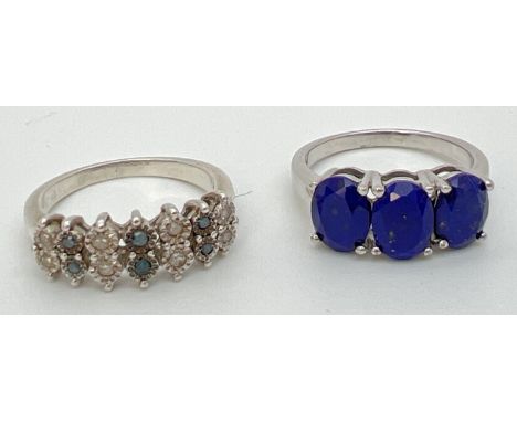 2 modern silver gemstone set dress rings. A Genuine Gem Company blue stone trilogy ring, Stamped 925 and TGGC inside band (ri
