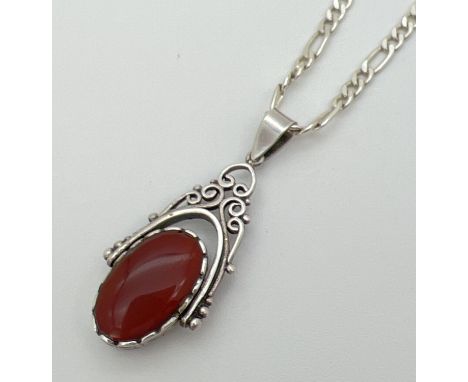 A silver rotating fob pendant set with onyx and carnelian on an 18" silver 2mm figaro curb chain. Pendant stamped 925 on bale