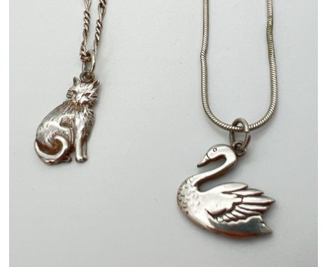 2 white metal animal shaped pendant necklaces on silver chains. An unmarked cat pendant on an 18" silver figaro chain with sp