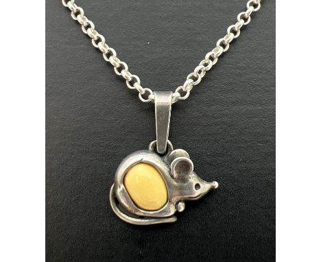 A silver pendant in the form of a mouse set with a small oval cabochon of white amber. On a 16" silver belcher chain with spr