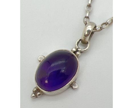 An amethyst pendant with 925 silver mount, on an 18" silver belcher chain with spring ring clasp. Pendant stamped 925 to reve