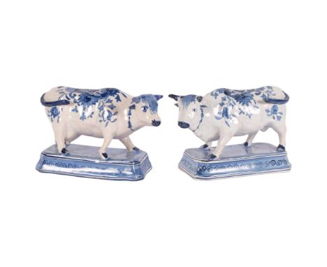 Delft blue and white pottery cow, length 20cm, base length 17cm, and another similar Delft cowGeneral light glaze crazing 