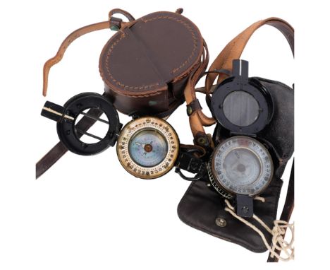 A Second World War Period military compass, marked G.E.C. no. B2328566, later leather case, and another military compass, mar
