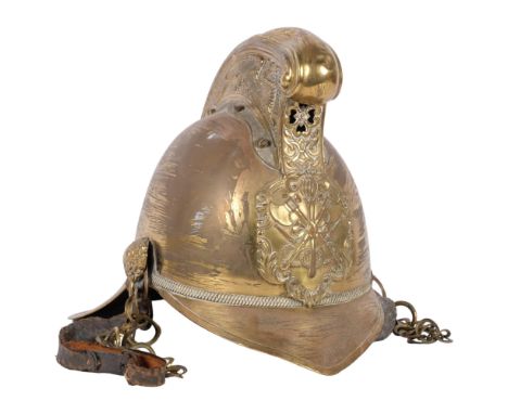 A brass fireman's helmet, with leather lining and original strap 