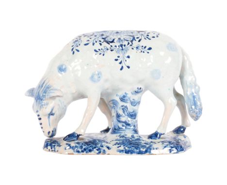 Delft blue and white pottery grazing sheep, length 20cm, height 14.5cmPossibly professionally restored ears, general light gl