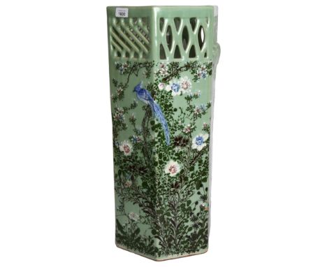 An Oriental design celadon octagonal stick stand, with bird and blossom tree decoration, H62cm 