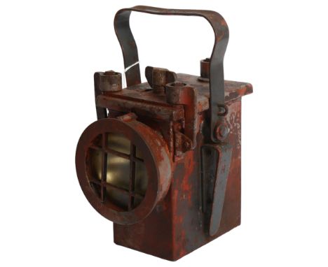 A Second World War Period railway lantern, with partial paint residue, marked with H 1943, and impressed mark, H22cm 