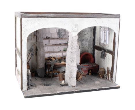 A painted plaster model of a blacksmith's forge on plinth, with various tools, shields, miniature pewter mugs, etc, W41cm 