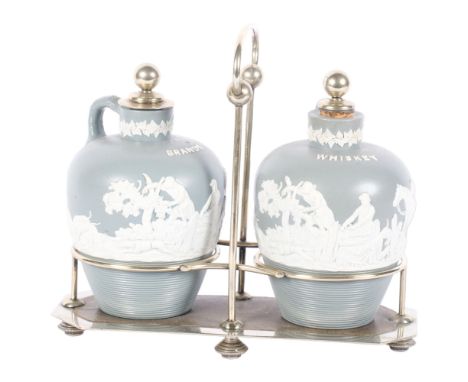 A pair of Jasperware type Whiskey and Brandy decanters, with plated stoppers, in silver plated stand, decorated with hunting 