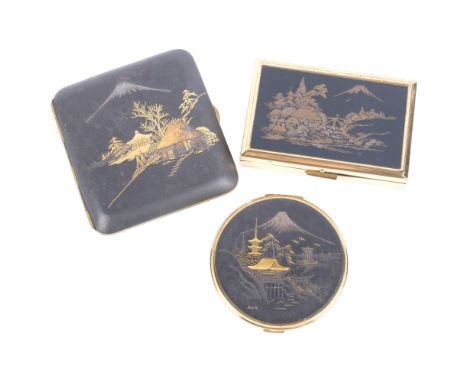 3 Japanese Komai pieces, including a cigarette case, compact, and a rectangular musical compact, all with Mount Fuji gilded d