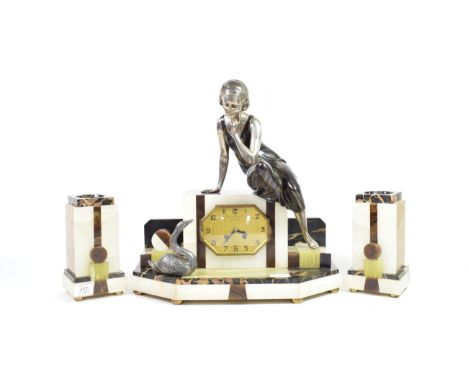Ugo Cipriani - Uriano (Italian, 1887-1960): A French Art Deco Patinated Spelter, Marble and Onyx Clock Garniture, modelled as